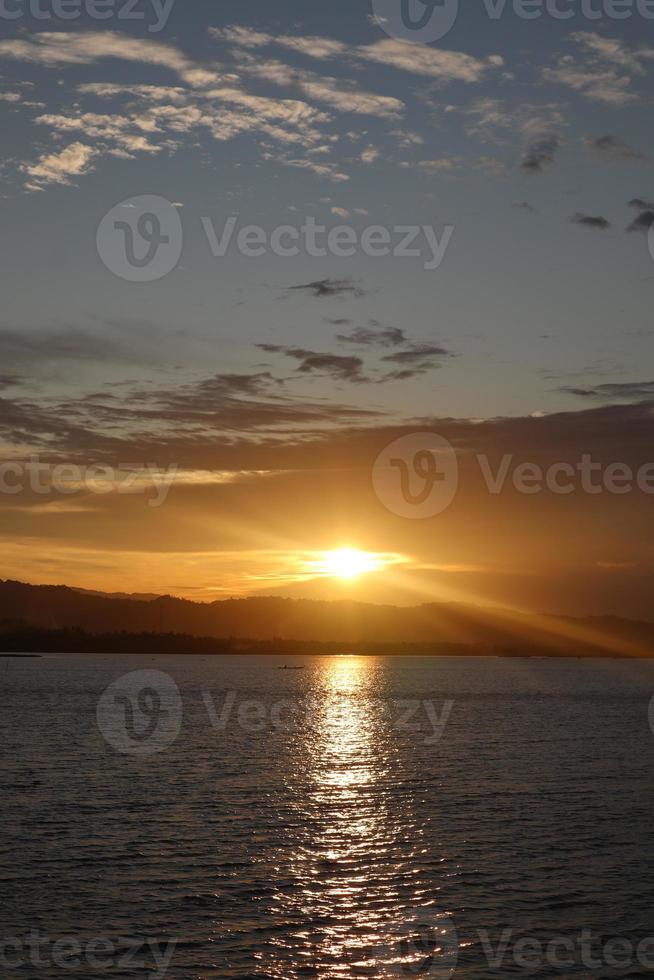 colorful dramatic sky with clouds at sunset. Sunset in the lake photo