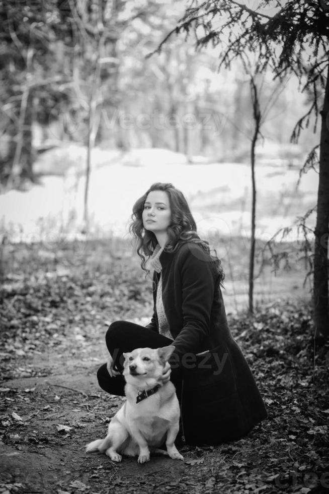 woman with her dog outdoors photo