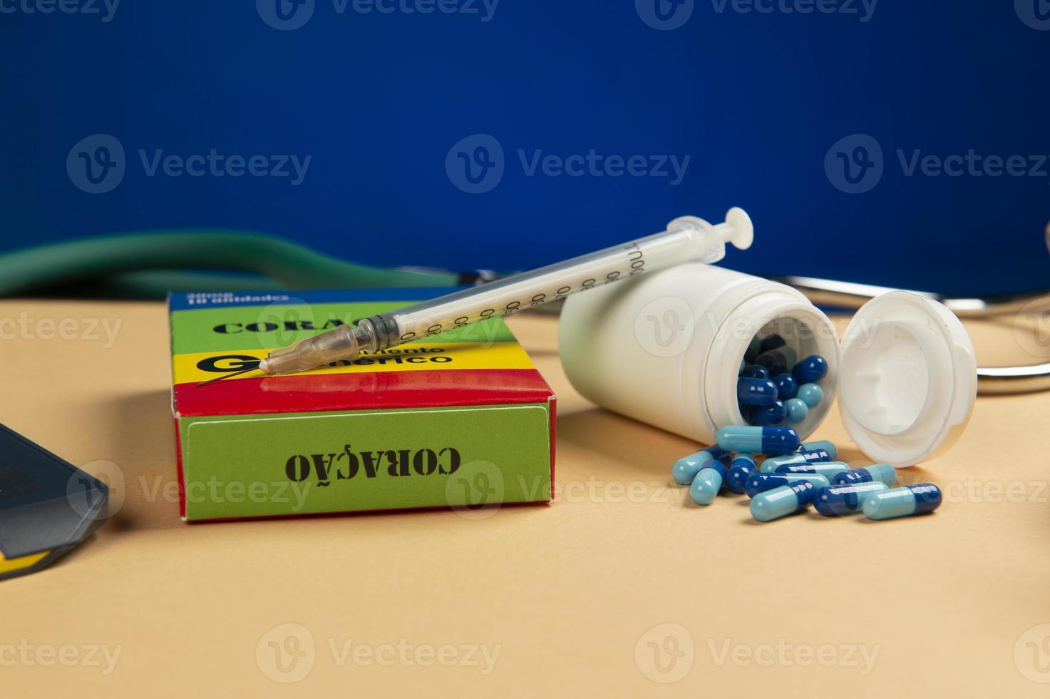 Fake medicine box with the name of the disease Coracao and a glucometer. photo