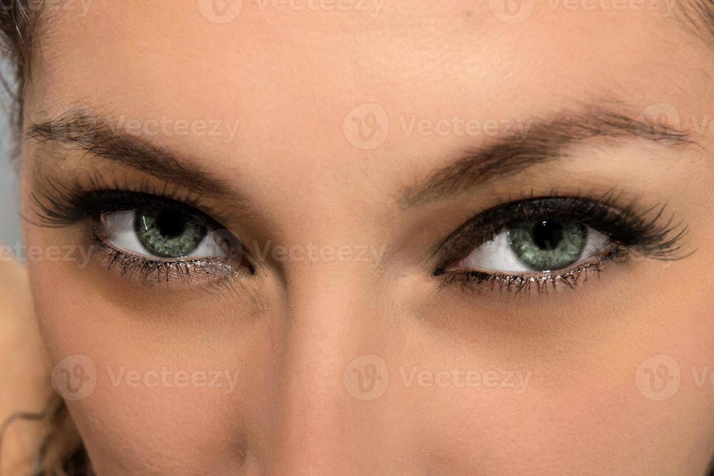 Grey and green eyes of beautiful latina girl photo