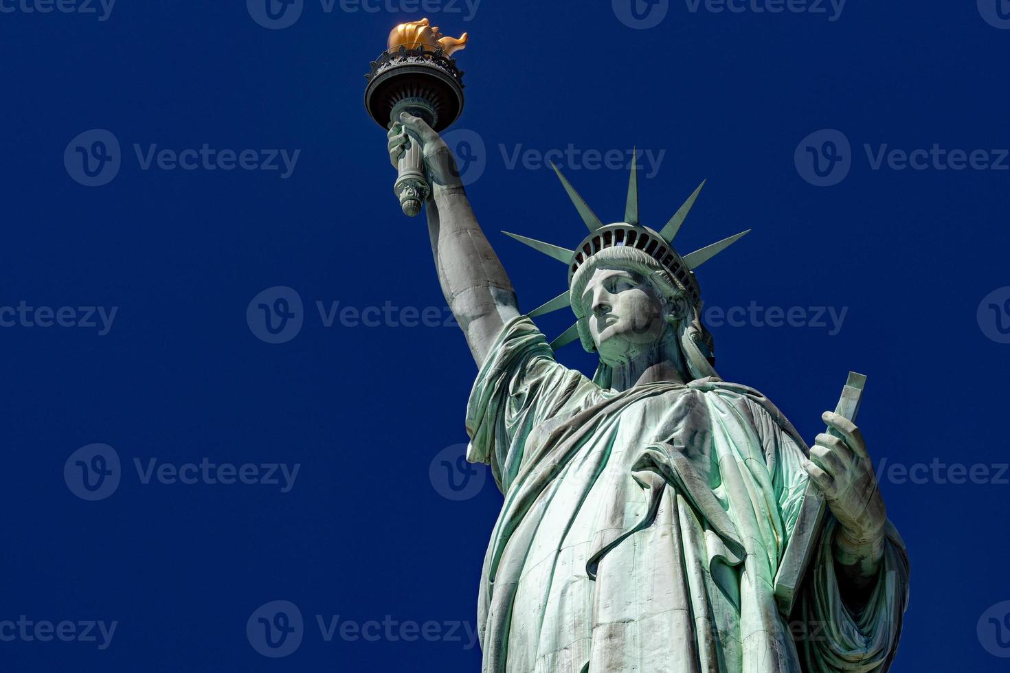 Statue of liberty in New York on blue sky photo