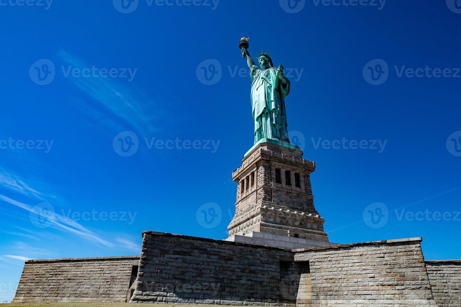 Statue of liberty in New York on blue sky photo