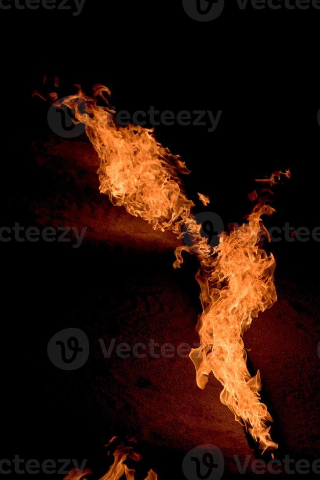 Orange Flames on black background photo