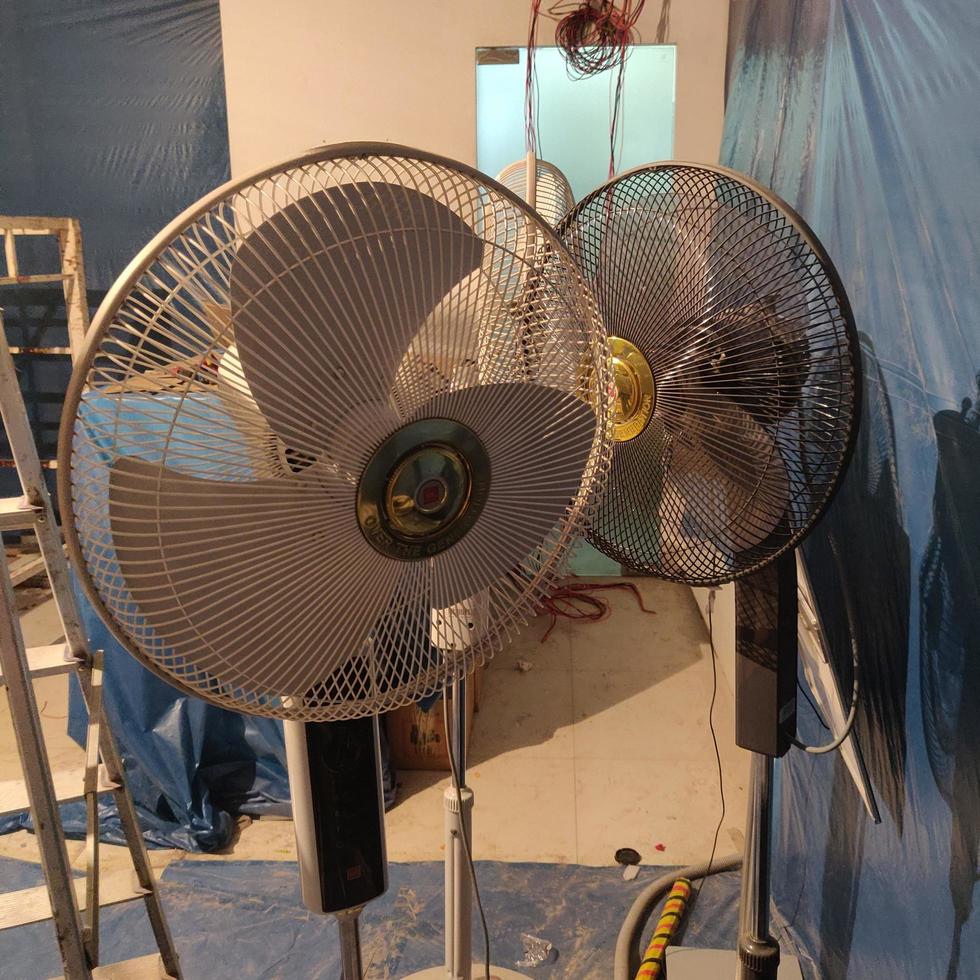 Closeup on electric floor standing fan photo