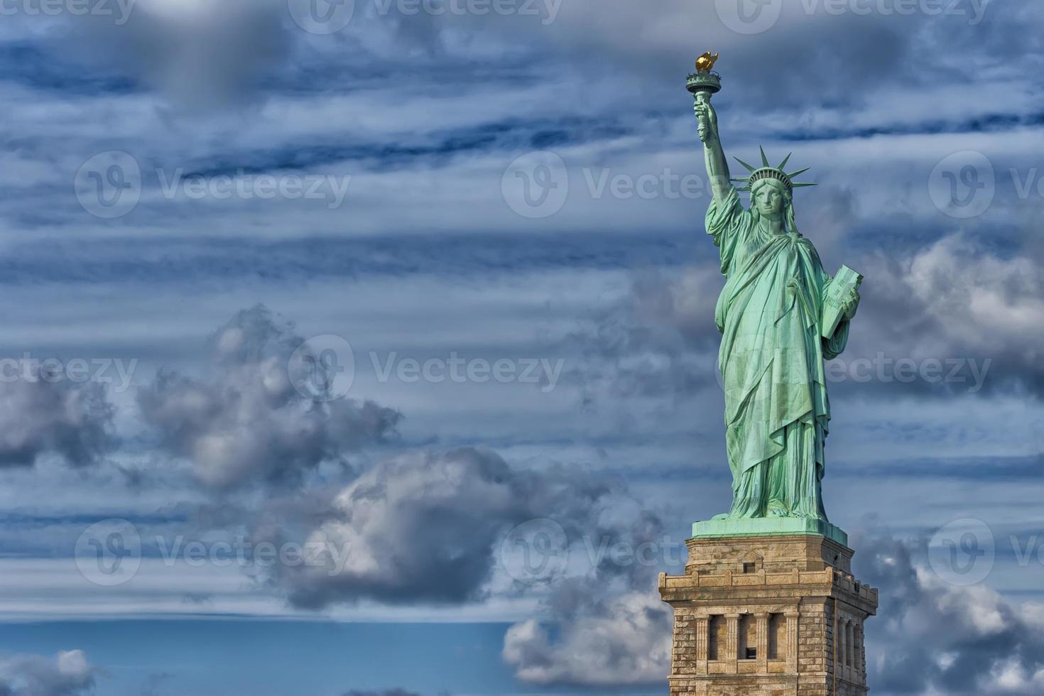 Statue Of Liberty in the deep blue sky photo