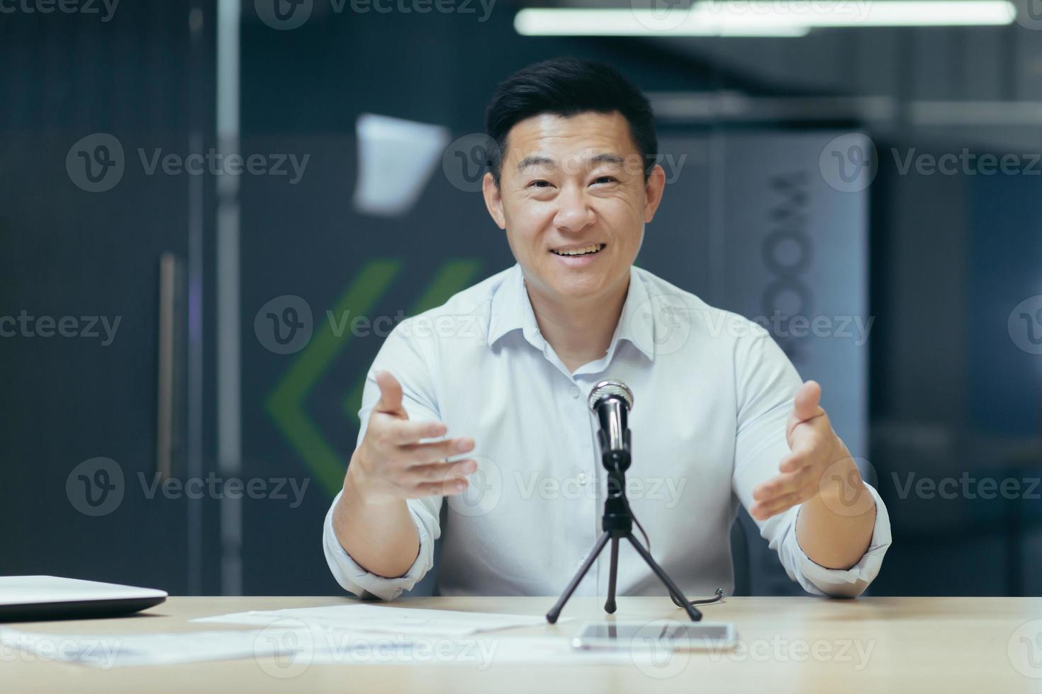 Close-up photo portrait of businessman man looking into web camera and smiling