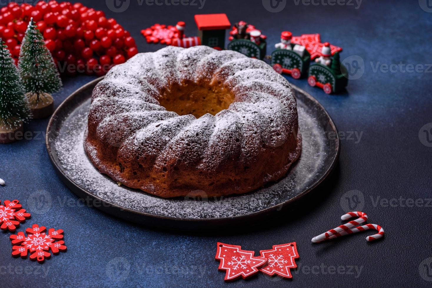 Homemade delicious round Christmas pie with red berries on a ceramic plate photo