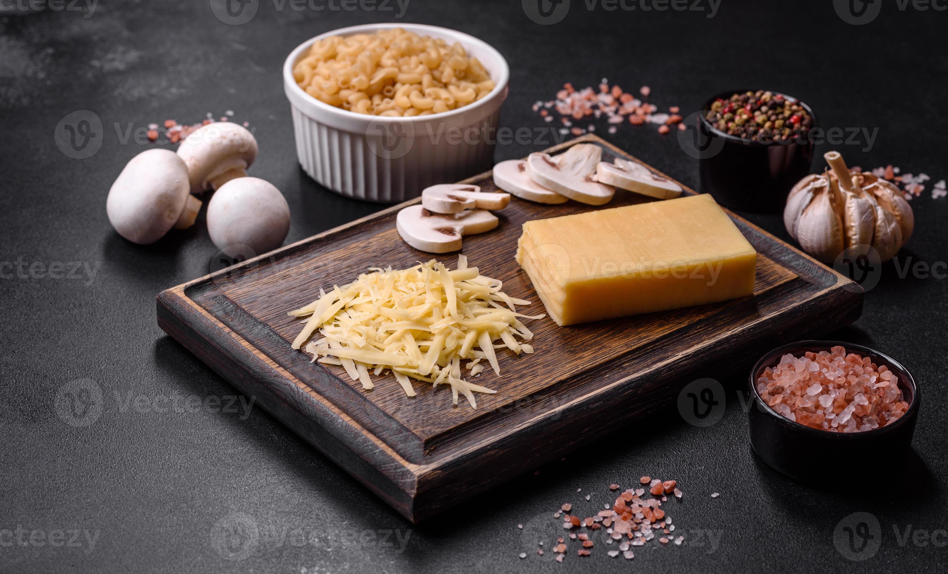 Raw pasta, mushrooms, onions, mince, spices and herbs to make a