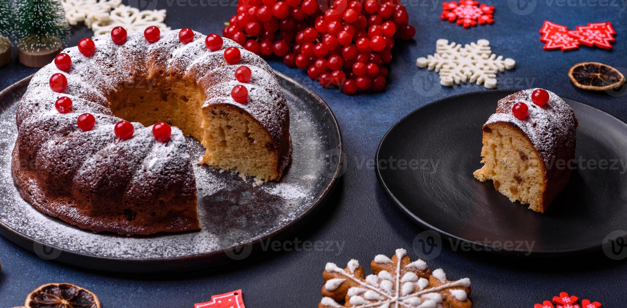 Homemade delicious round Christmas pie with red berries on a ceramic plate photo