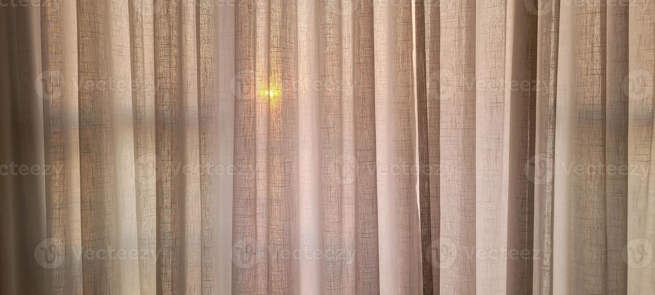 white linen curtain in apartment with sunset view in Brazil photo