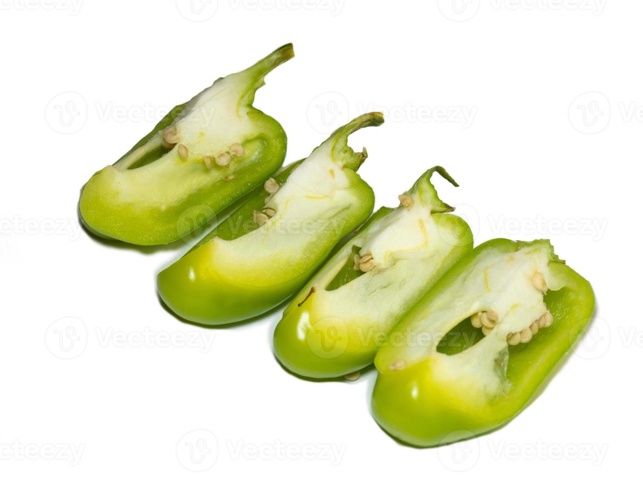 Sliced dolma pepper on a white background. A juicy beautiful vegetable. Green sweet pepper. photo