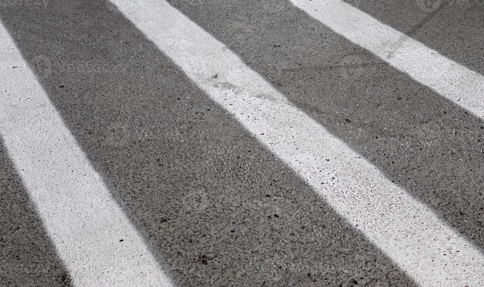 Detailed view on asphalt surfaces of different streets and roads with cracks photo