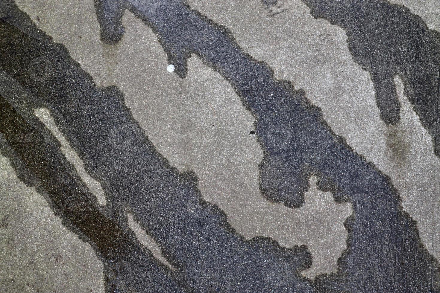 Detailed view on asphalt surfaces of different streets and roads with cracks photo