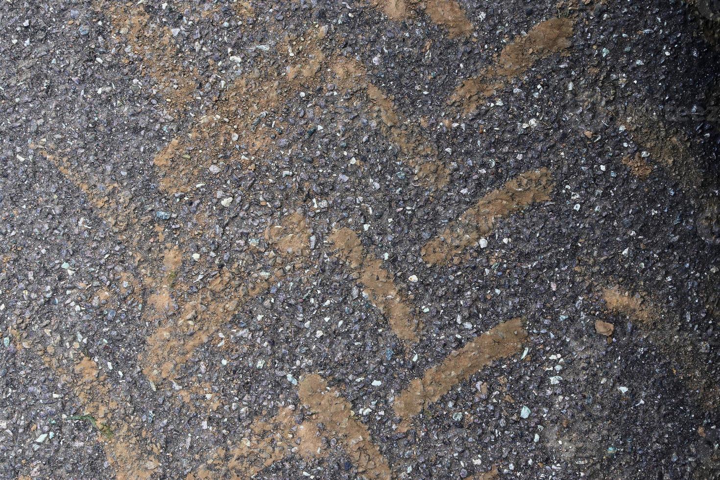 Detailed view on asphalt surfaces of different streets and roads with cracks photo