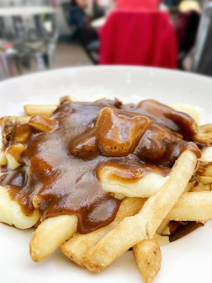 Delicious poutine with gravy at a restaurant photo