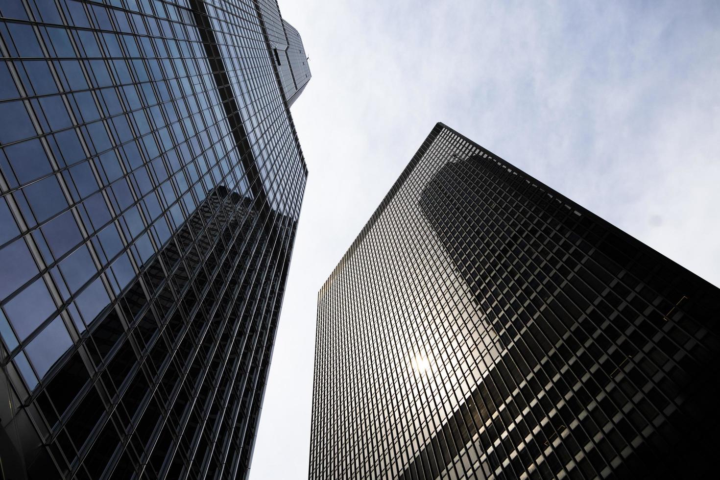 Tall skyscraper buildings in the middle of a city photo