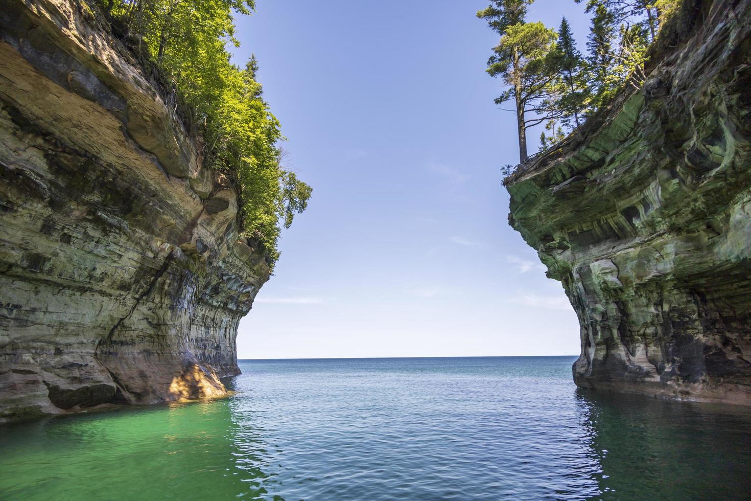 Colorful stone rocks on the edge of a lake in the summer photo