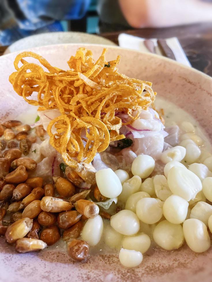 Variety of corn and onions on a plate at a restaurant photo