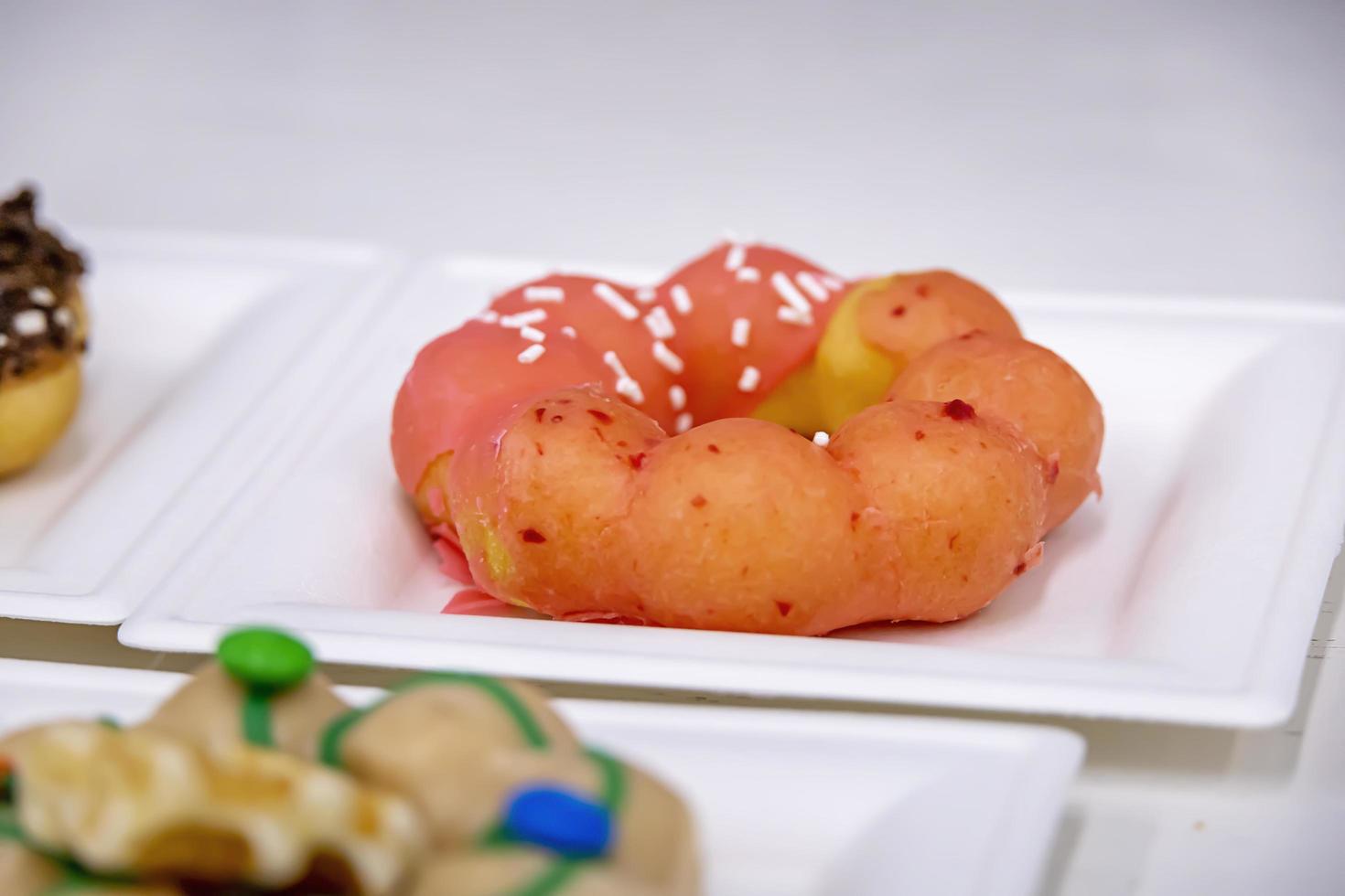 Colorful brioche style donut on a plate in a restaurant photo