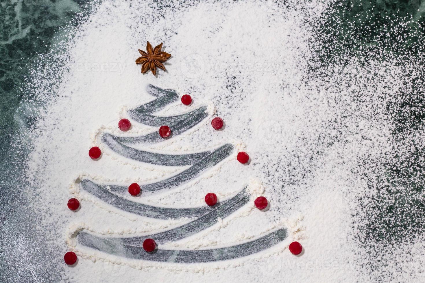 Christmas tree with the flour, berries and anise star spices as a decoration - homemade baking photo