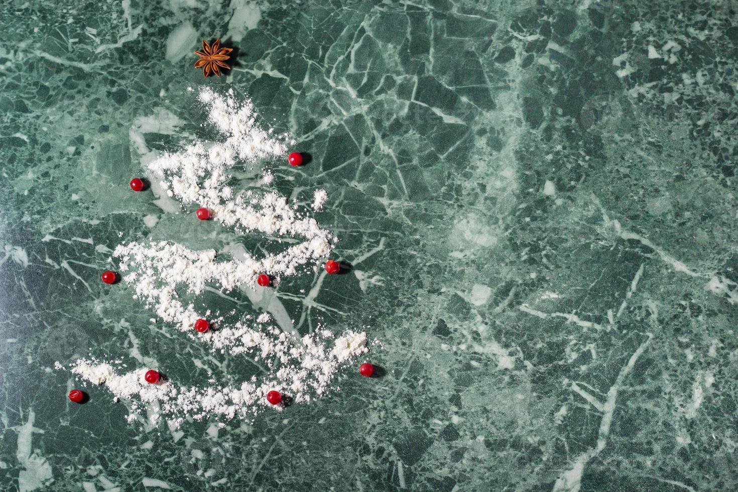 Christmas tree with the flour, berries and anise star spices as a decoration - homemade baking photo