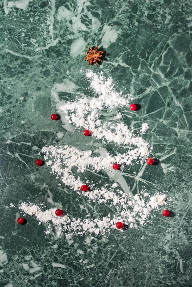 Christmas tree with the flour, berries and anise star spices as a decoration - homemade baking photo