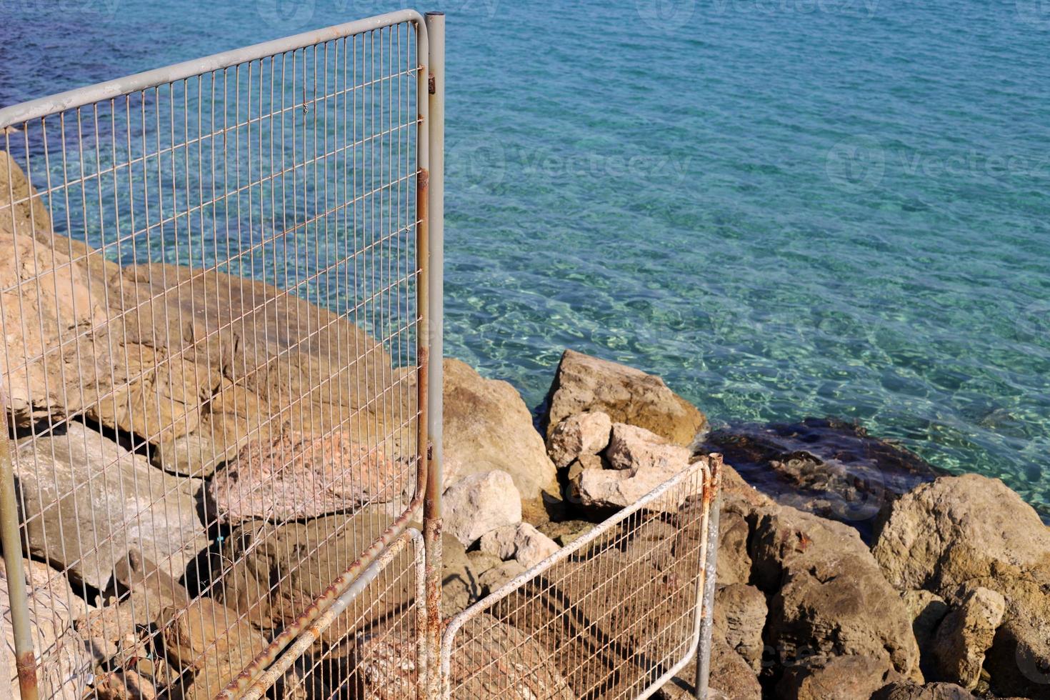 Fence in the city park on the shores of the Mediterranean Sea. photo