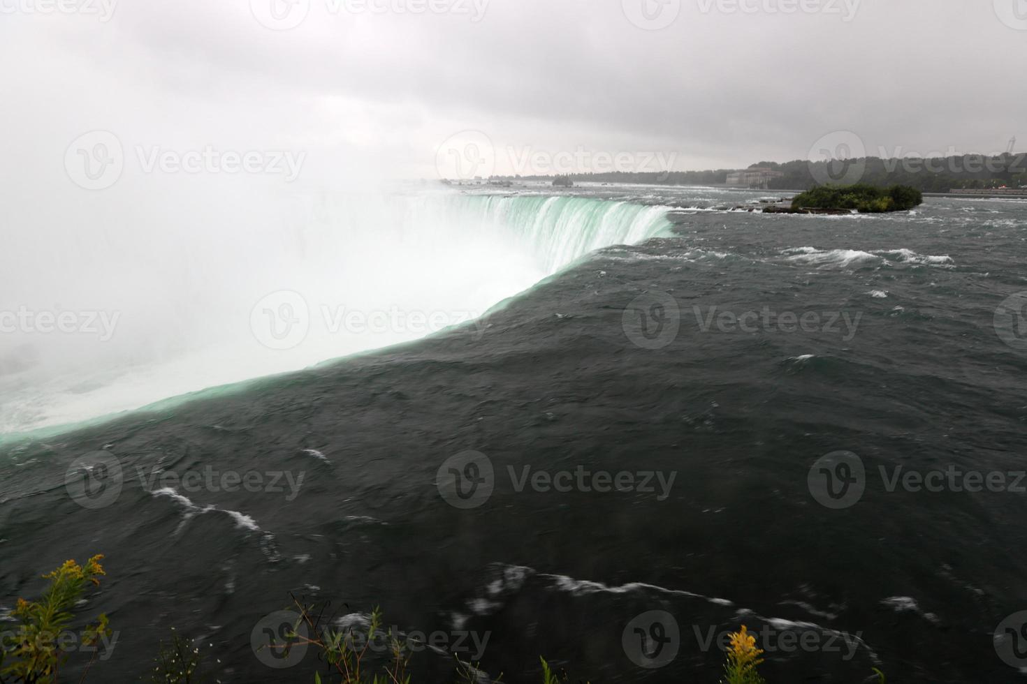Canadian Falls on the Niagara River on an autumn rainy day. photo