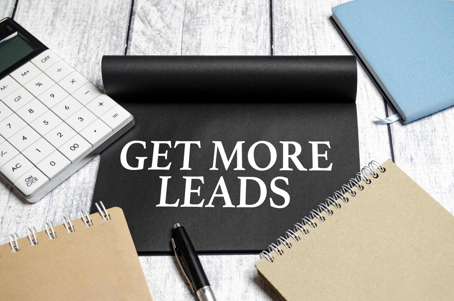 Get More Leads text as memo on notebook with pen photo