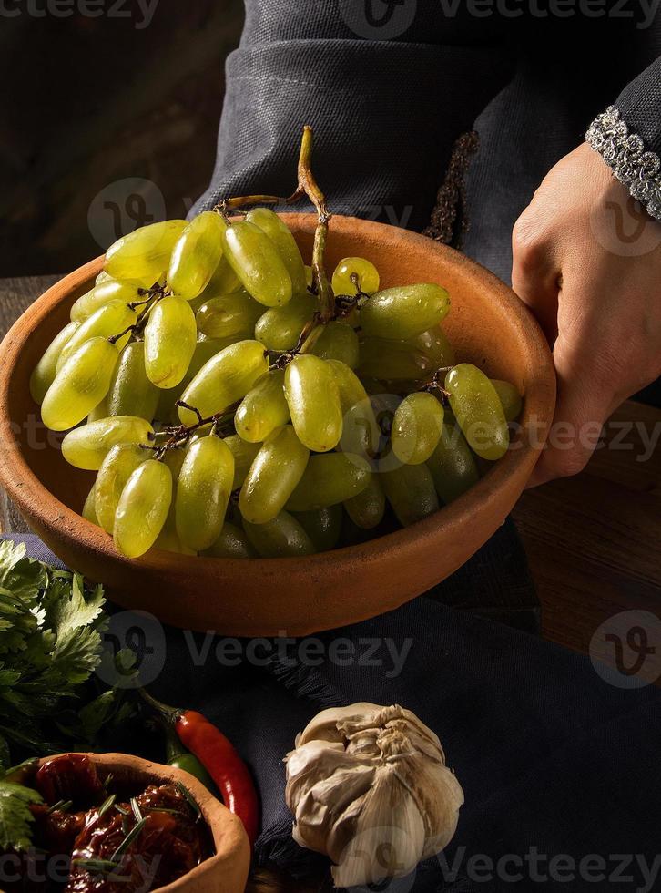 A shot of grapes in a bowl photo