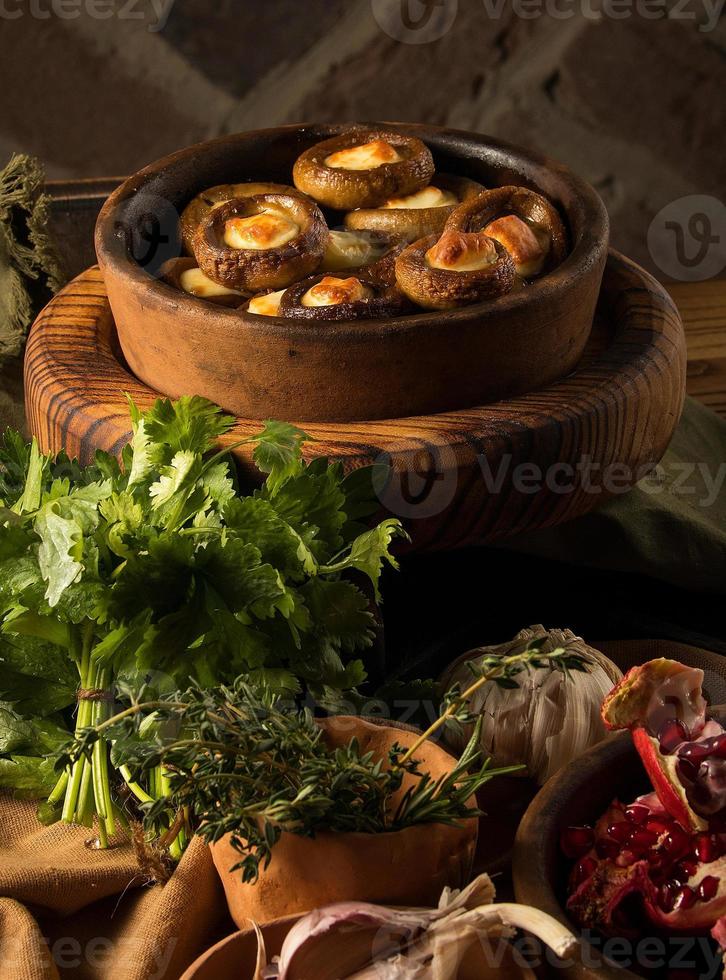 A shot of a dish and pomegranates photo