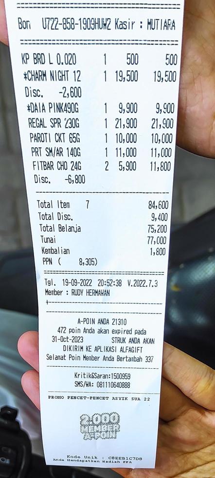 Sidoarjo, Jawa timur, Indonesia, 2022 - close-up photo of shopping receipt with gift points from Alfamart store