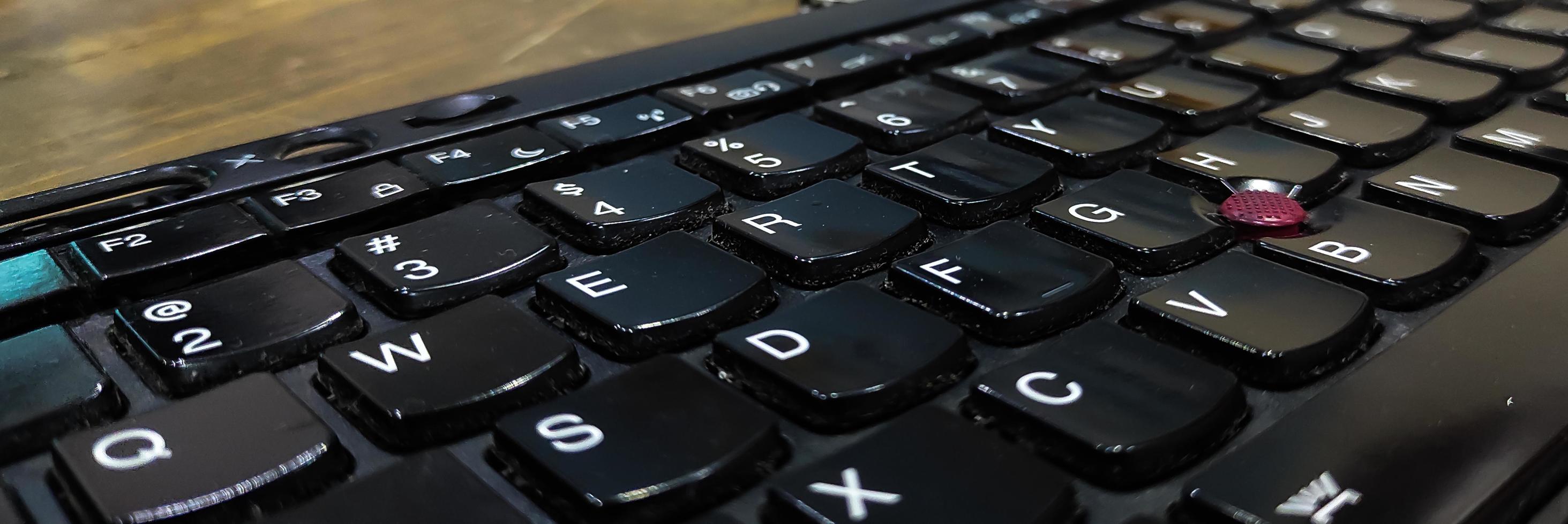 Close up photo of laptop keyboard on table