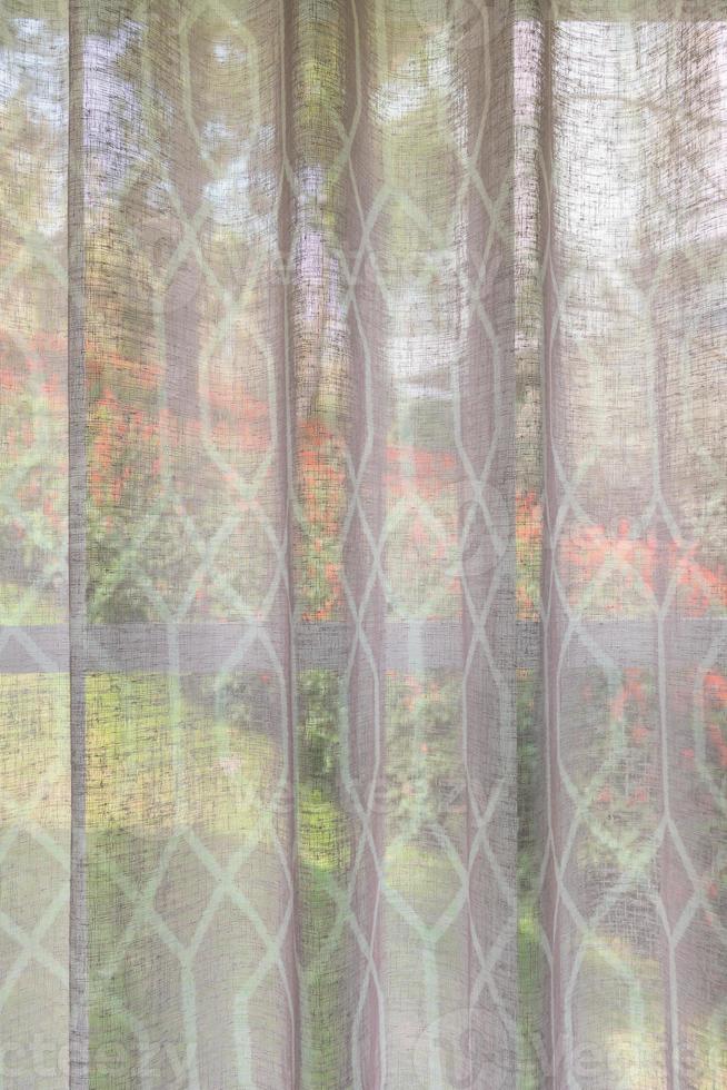 Abstract window curtain with flower garden closeup background photo