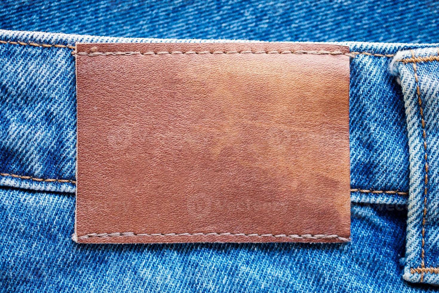 Blue denim jeans leather label texture background photo