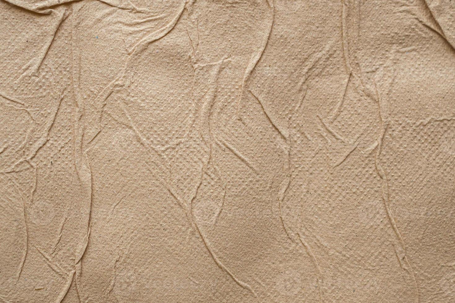 Crumpled brown recycle tissue paper texture abstract background photo