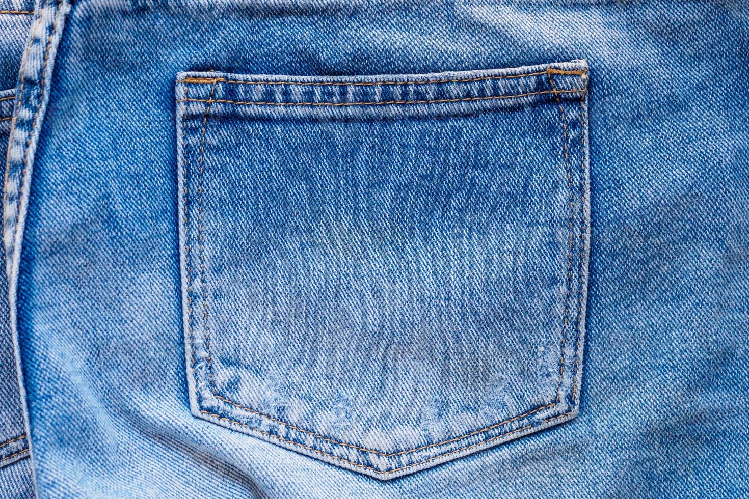 vaqueros de mezclilla azul bolsillo trasero de cerca foto