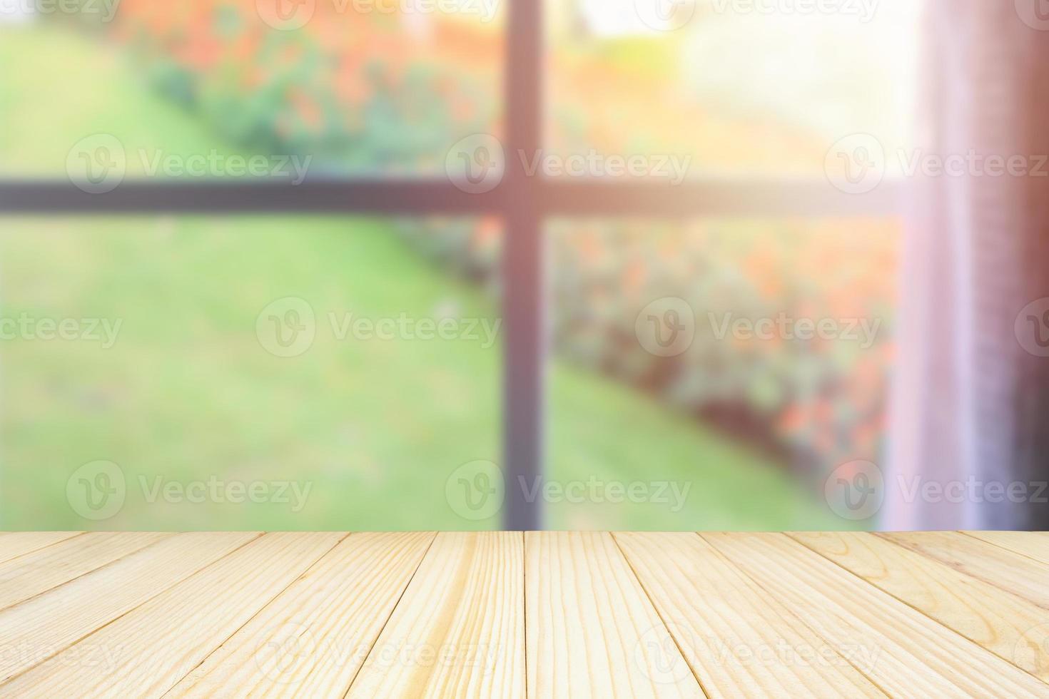 Empty wood table top with window curtain abstract blur background for product display photo