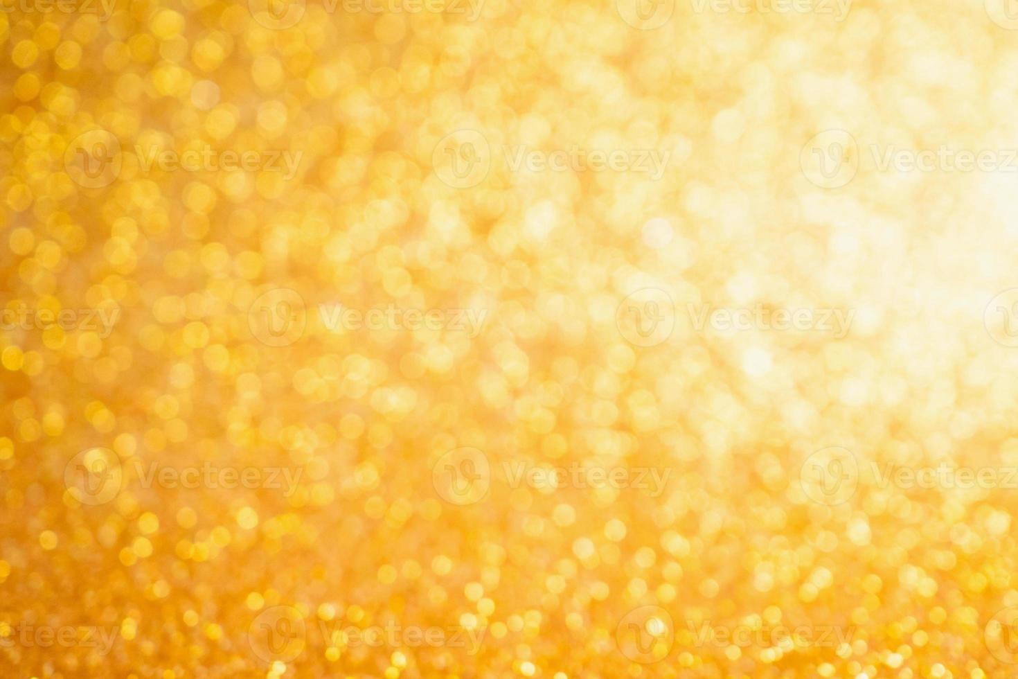 Abstract Gold glitter festive Christmas texture background blur with bokeh light photo