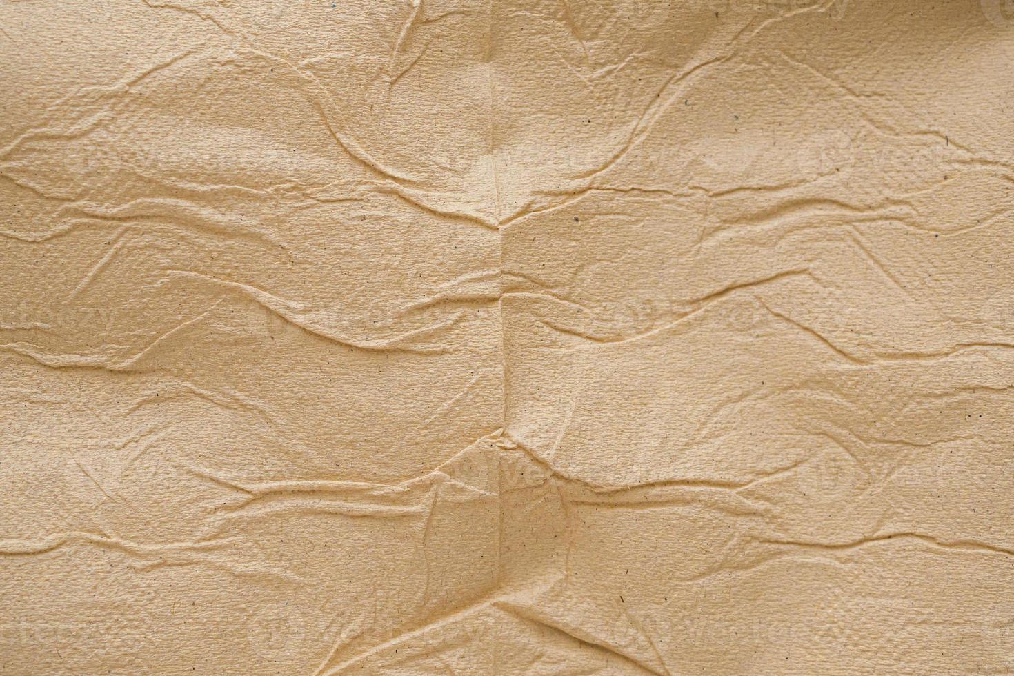 Crumpled brown recycle tissue paper texture abstract background photo