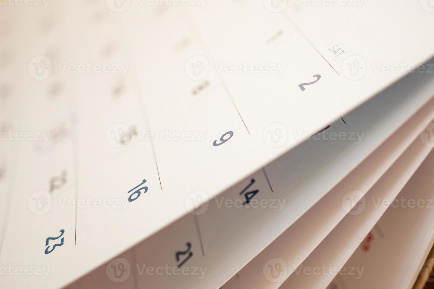 Abstract blur calendar page flipping sheet close up background photo