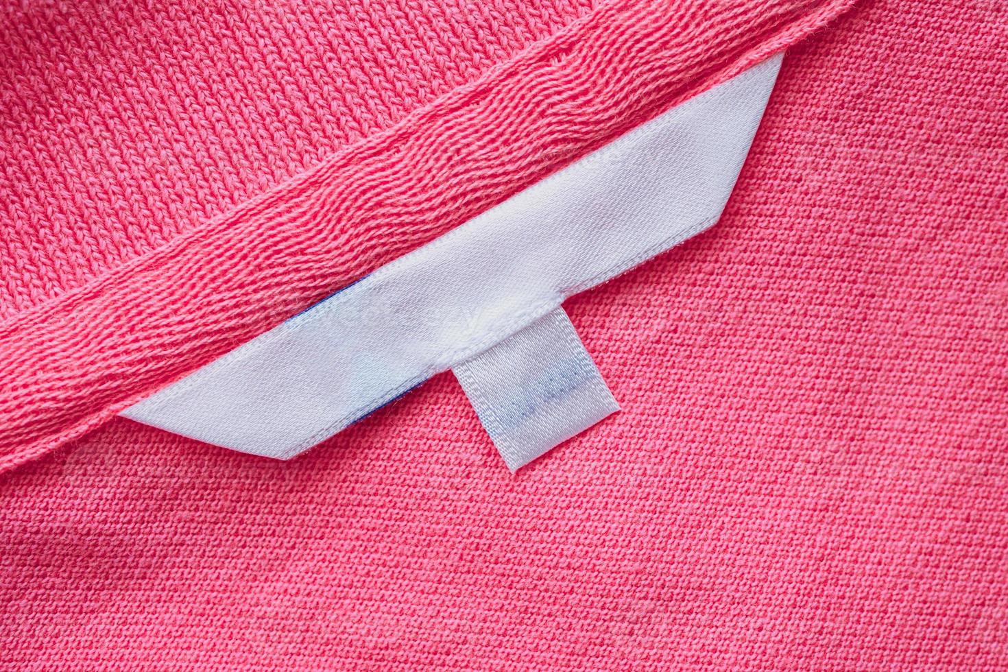 Blank white clothes label on new shirt photo