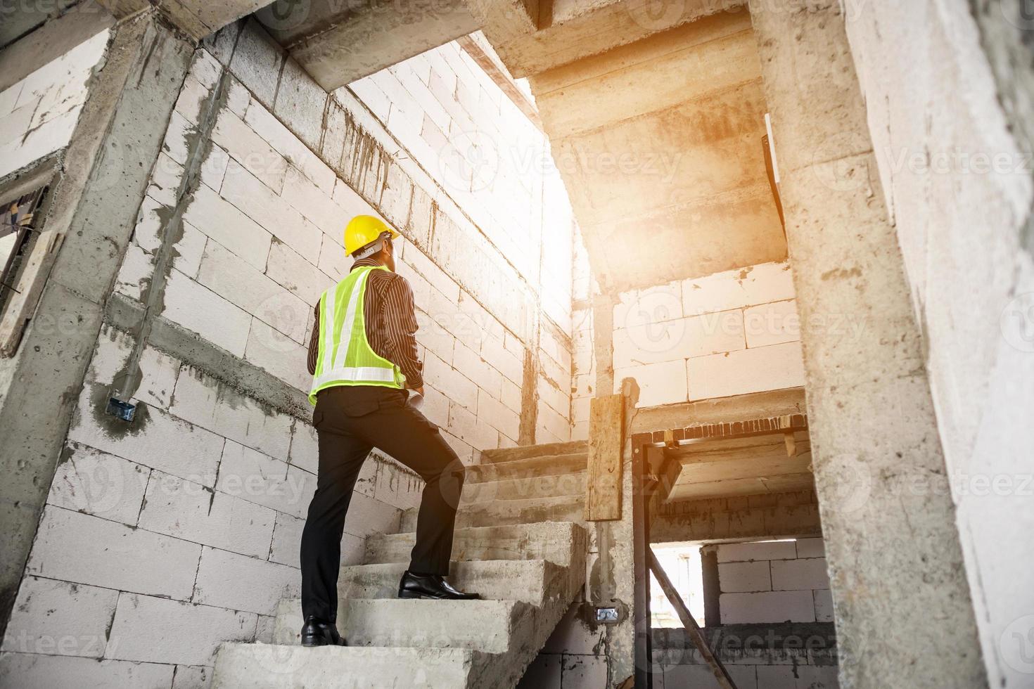 professional engineer worker at the house building construction site photo