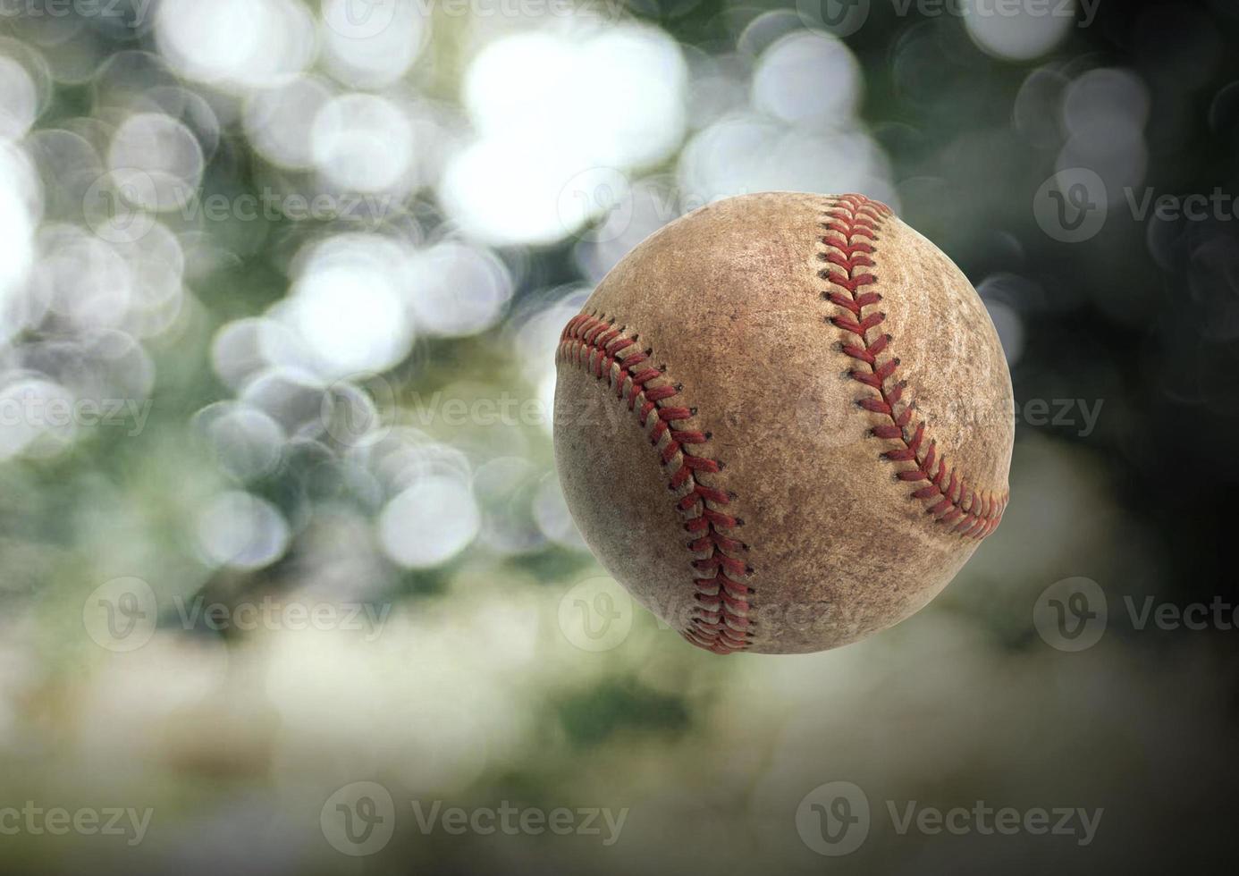 béisbol en el fondo borroso del bokeh foto