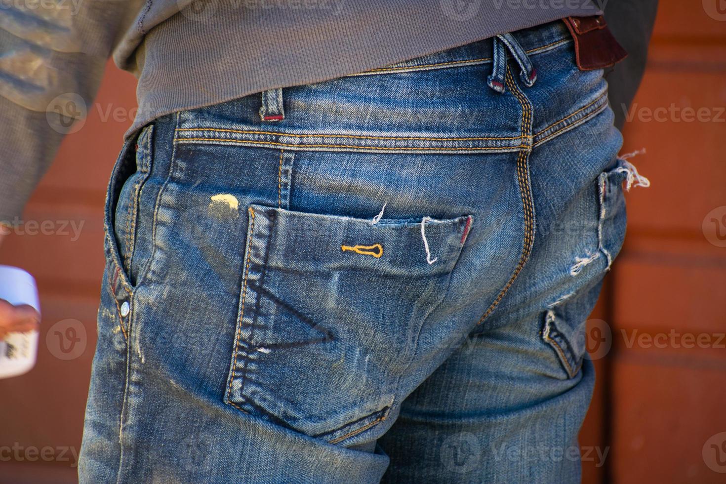 Man in work clothes. View from the back, close-up. Concept of work and employment. photo