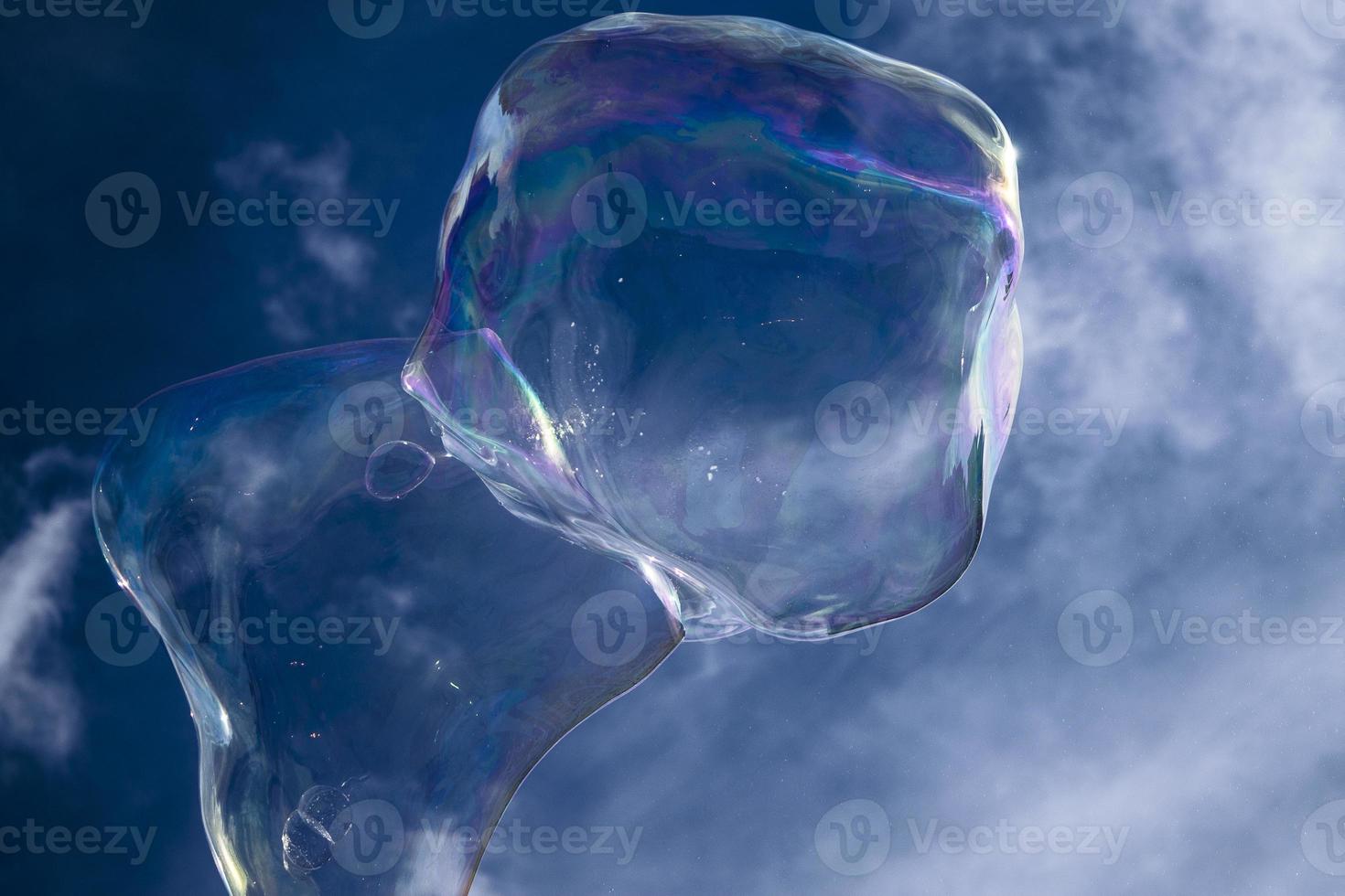 Wonderful soap bubbles against blue sky photo