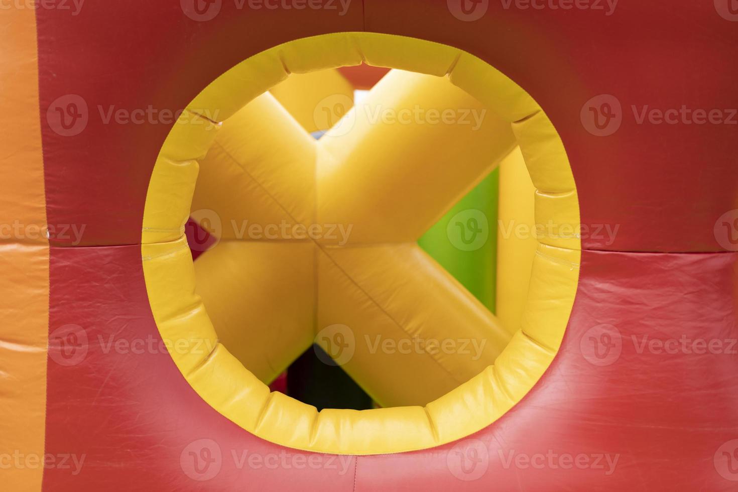 Obstacle course is red. Inflatable amusement park. Attraction for children. photo