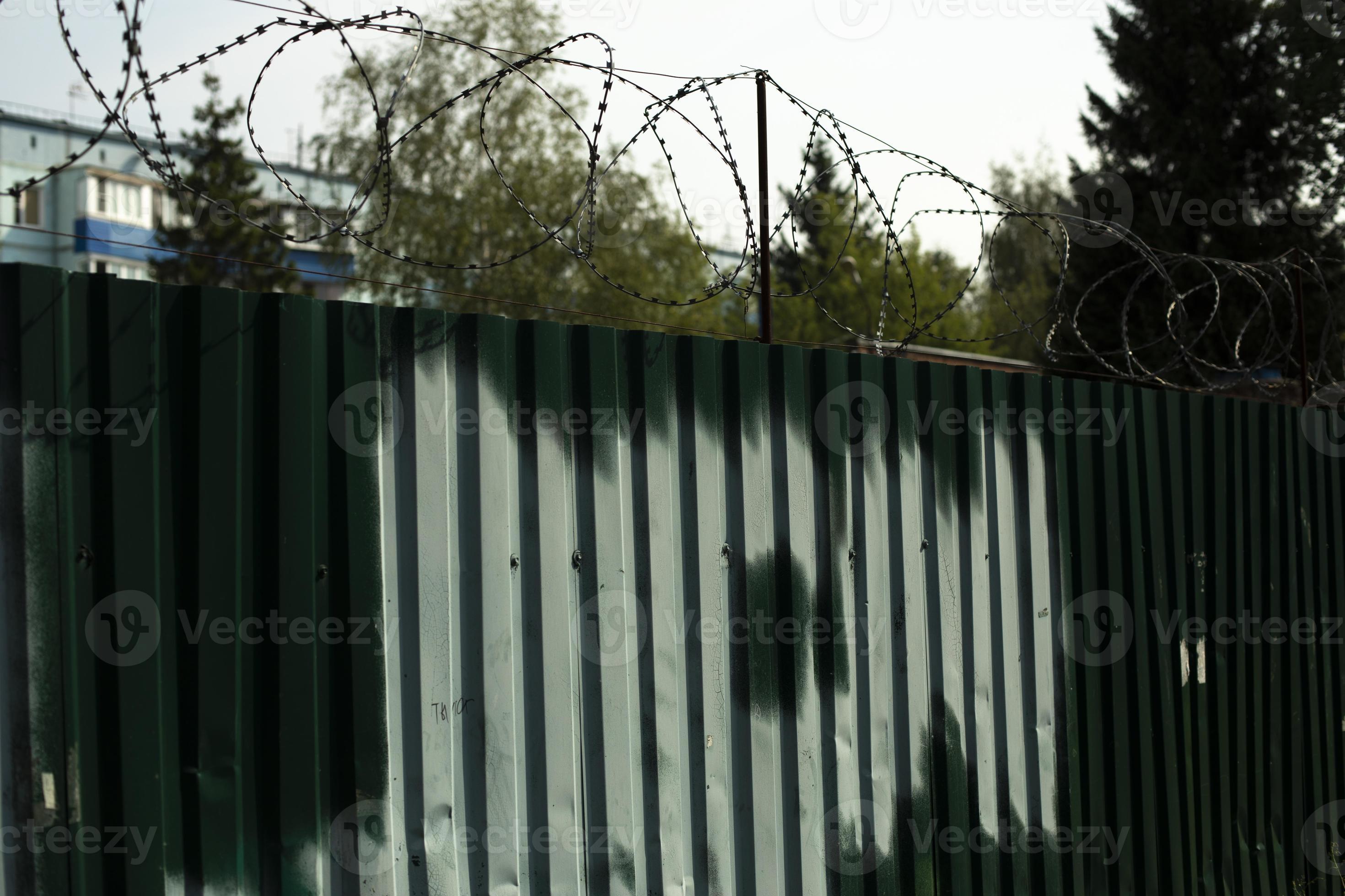Fence with paint. Steel fence with wire. Paint on steel profile