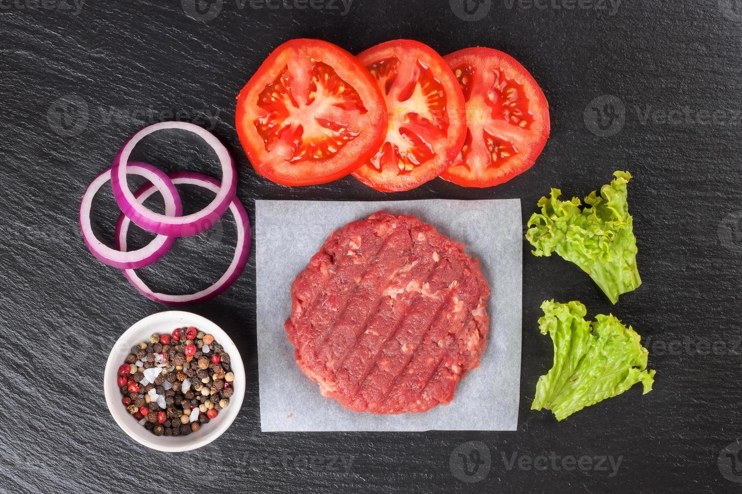 raw home-made beef burger cutlet. burger ingredients photo