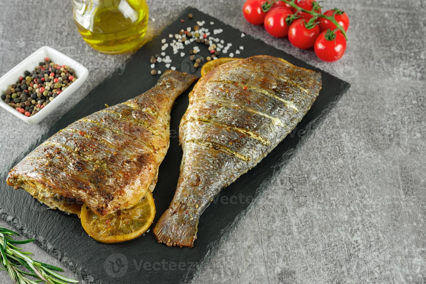 Grilled fish with roasted with lemon and spices photo